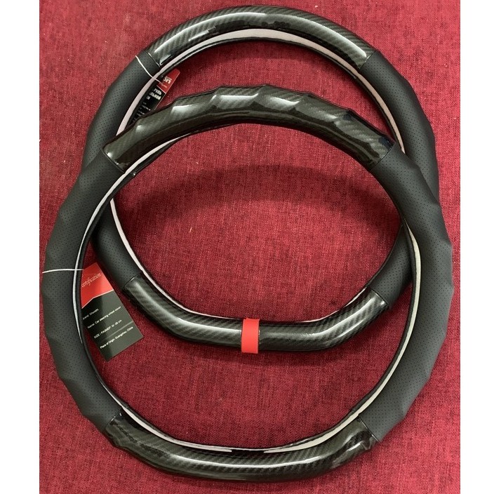 Bọc vô lăng D Cut , da Cacbon cho xe Elantra, Kia Seltos, Suzuki XL7 hàng chuẩn loại 1 - Auto Bảo Lộc