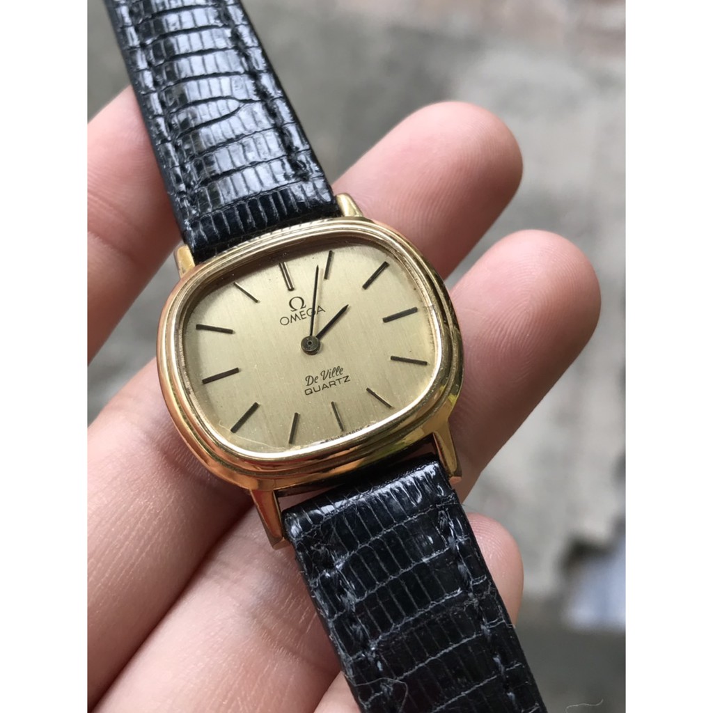 Đồng hồ nữ Omega mặt vàng dây da đen
