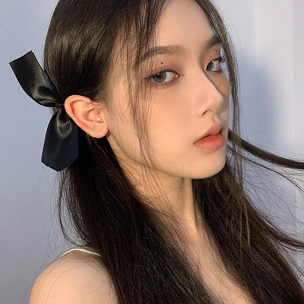 Kẹp tóc nơ có màu đen kiểu dáng thời trang
