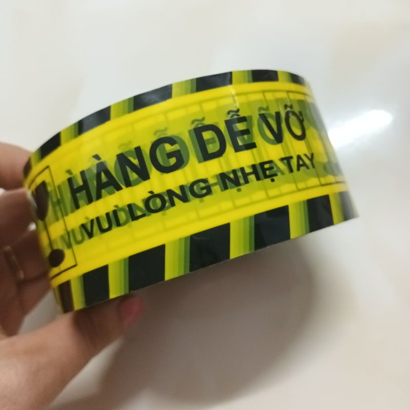 Cuộn băng keo vàng in chữ Hàng dễ vỡ vui lòng nhẹ tay siêu to 200 yard nặng 325g