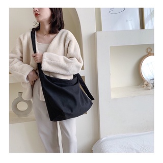 Túi đeo chéo dây rút vải canvas