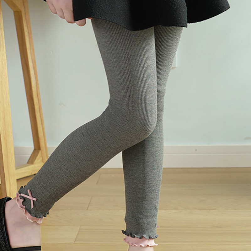 Quần legging co giãn màu trơn đính nơ xinh xắn thời trang cho bé gái