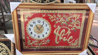 Tranh đồng hồ bằng đồng
