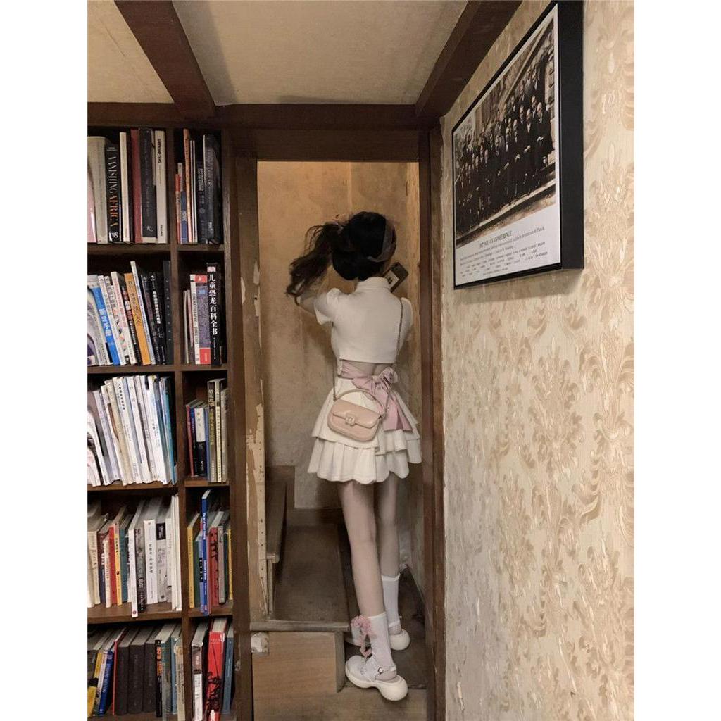 Set Áo Cổ polo + Chân Váy Ngắn Màu Hồng Đính Nơ Xinh Xắn Thời Trang