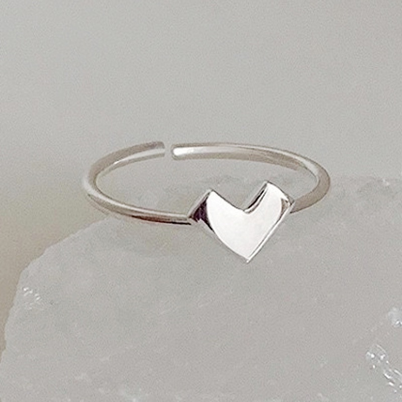 Nhẫn đeo ngón tay dạng hở điều chỉnh kích thước được thiết kế trái tim rỗng hợp kim màu bạc thời trang dành cho nữ