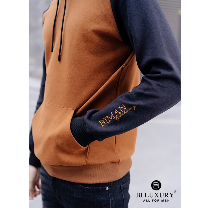 [Mã FAMALLT5 giảm 15% đơn 150K] Áo nỉ nam thể thao Biluxury có mũ hoodie màu vàng 4ANOT012VAB