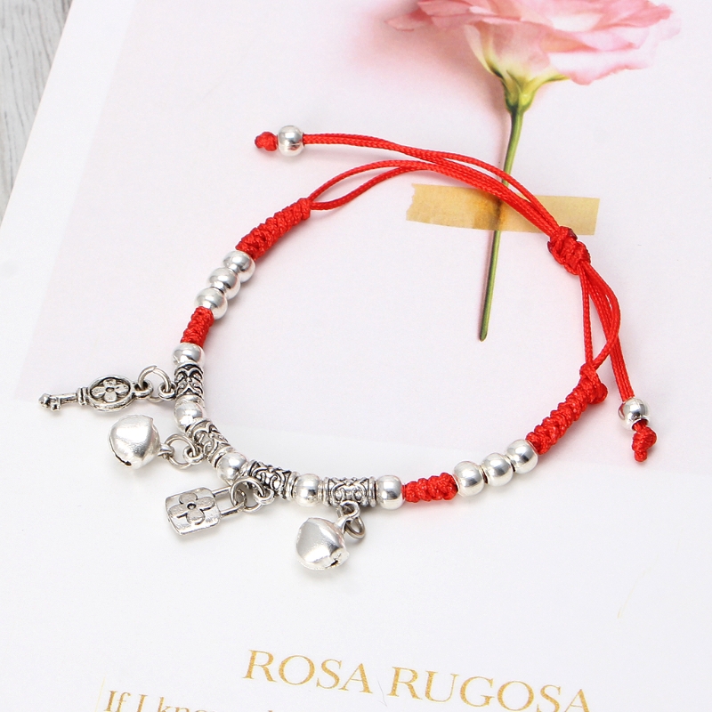 Vòng tay dây đỏ chuông bạc may mắn