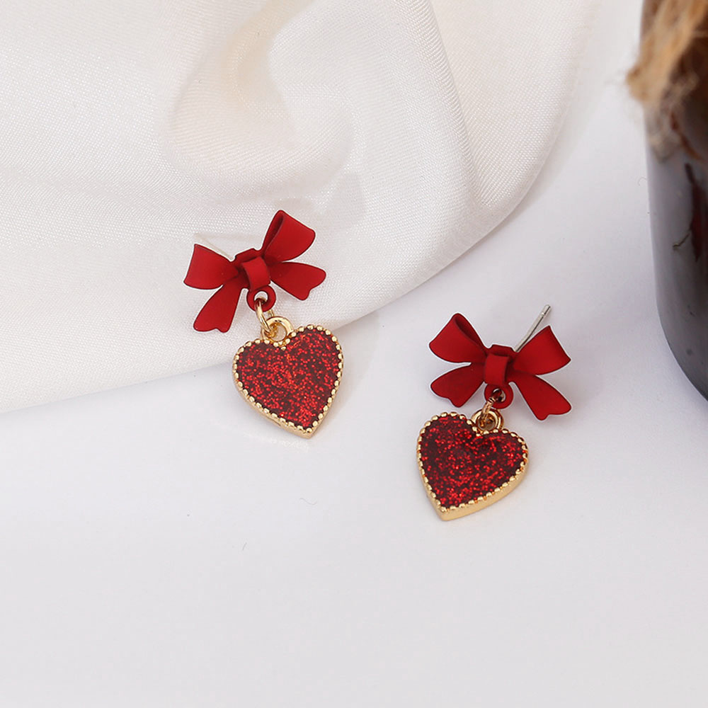 Cặp bông tai hình nơ gắn trái tim màu đỏ đáng yêu cho nữ