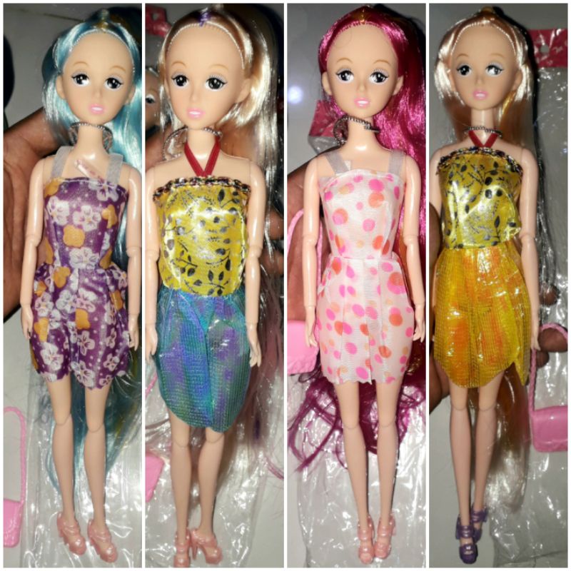 Một bé búp bê có 11 khớp tóc dài 2 màu kèm chiếc ví bằng nhựa rất đẹp (chỉ phân loại màu tóc)