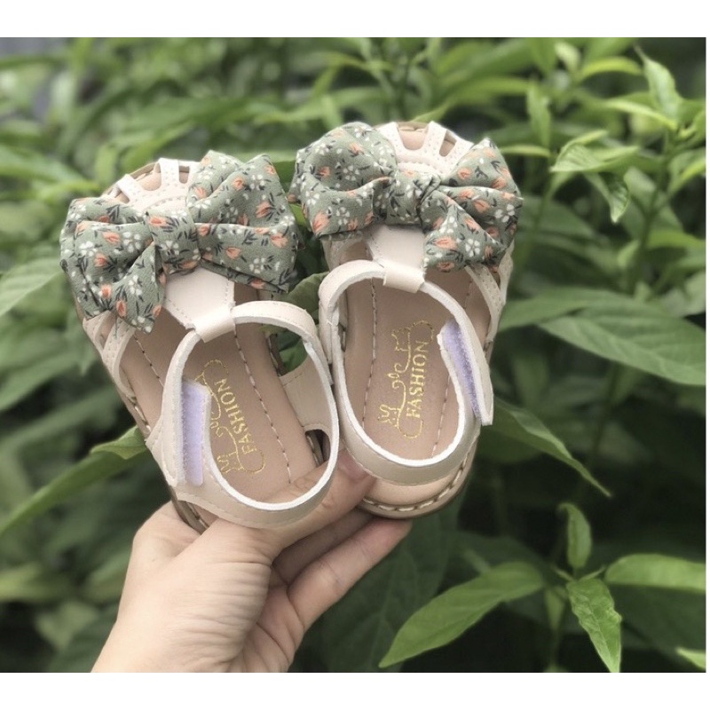Sandal tập đi cho bé gái - Dép quai hậu rọ cho bé từ 6th có nơ vải hoa nhí xinh xắn điệu đà chống trượt đế dẻo QCCC A2