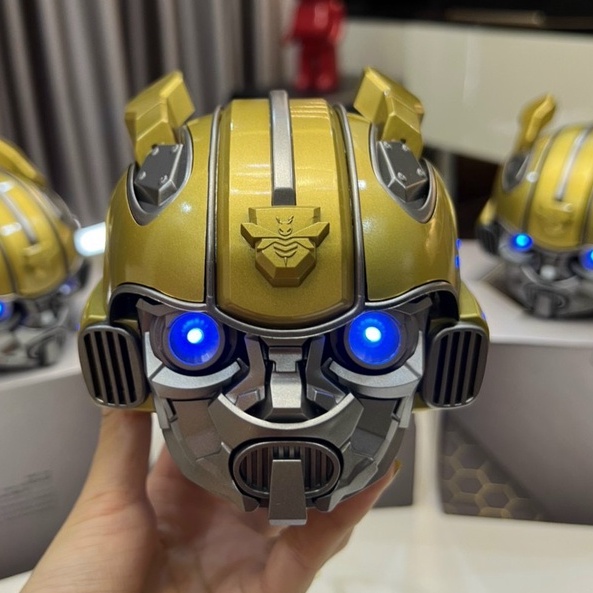 Loa Bluetooth Nghe Nhạc Siêu Bass Bumblebee Đầu Robot Mắt Có Đèn Led Xanh Âm Thanh Sống Động