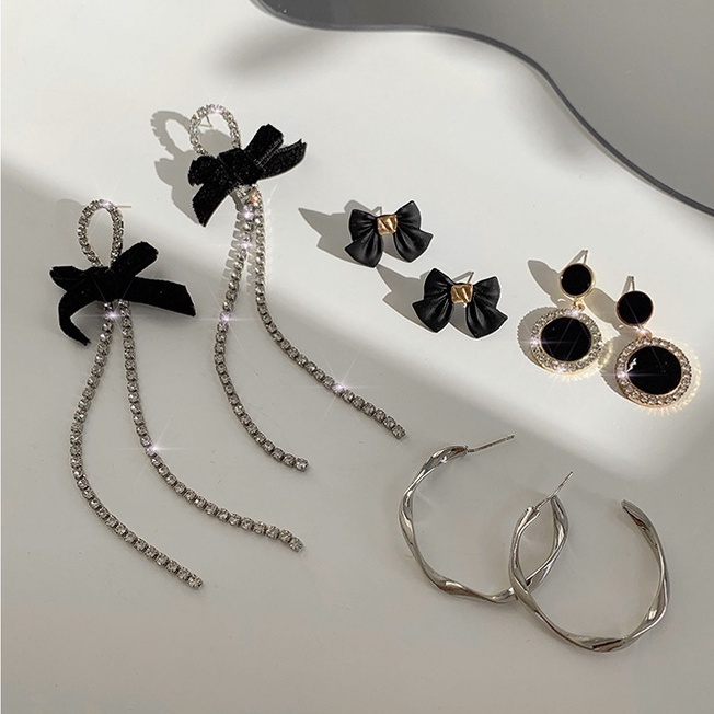 Bông tai dài hình nơ tua rua đơn giản