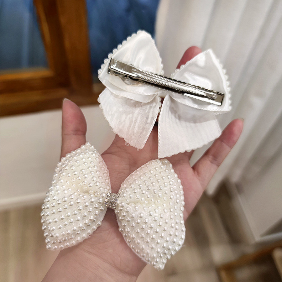 Kẹp tóc trang trí nơ nơ đính hạt ngọc trai phong cách Hàn Quốc