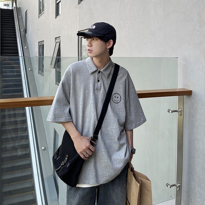 Áo thun polo ngắn tay dáng rộng in hình mặt cười phong cách Hàn Quốc cho nam và nữ