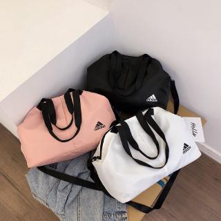 The lightweight, large capacity adidas sports bag can hold wet / dry