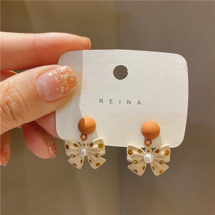 Bông tai hình nơ chấm bi cam thời trang nữ/ Khuyên tai phong cách Hàn Quốc