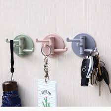 Móc dán tường 3 nhánh bằng nhựa .