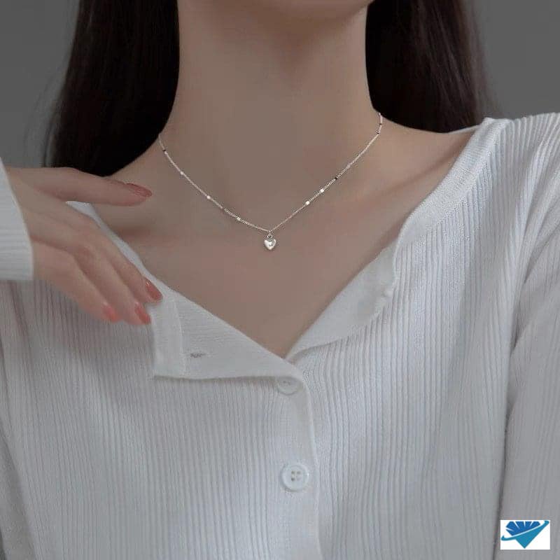 DÂY CHUYỀN TREO TIM BẠC TA XI VÀNG