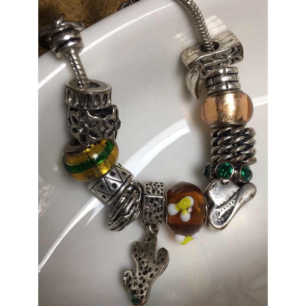 Lắc tay charm vintage-chốt cài then mu ra no