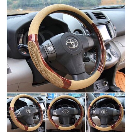 Bọc volang oto, bao tay lái xe hơi da vân gỗ pha gân massage