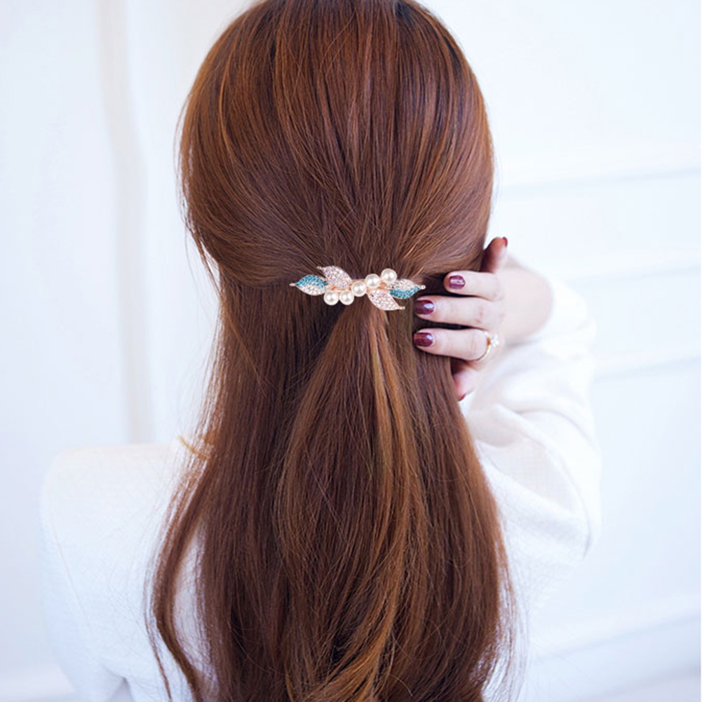 Kẹp tóc phối hình nơ đính kim cương giả và ngọc trai thanh lịch