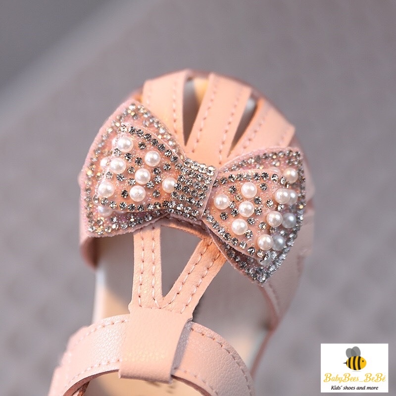 Sandal quai rọ tập đi cho bé gái, dép quai hậu đính nơ có kim sa lấp lánh cho bé từ 0 đến 4 tuổi, 2 màu trắng - hồng a10
