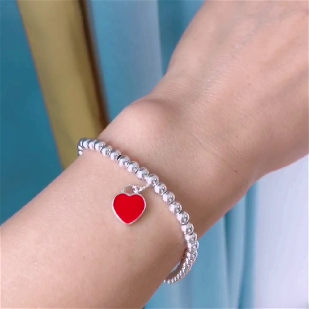 1 vòng tay chuỗi hạt hình trái tim ba màu sắc thời trang cho nữ