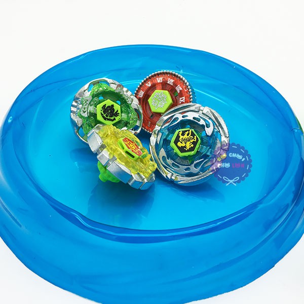 Vỉ đồ chơi sàn đấu 4 con quay 2 tay cầm