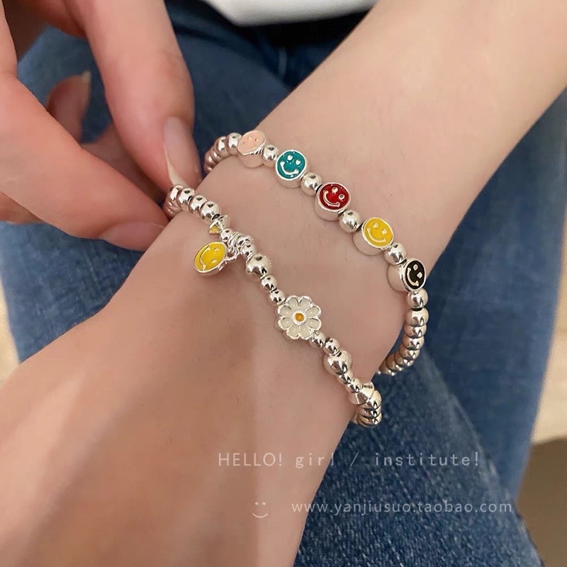 Vòng tay dây cước charm mặt cười - hoa cúc - bánh donout