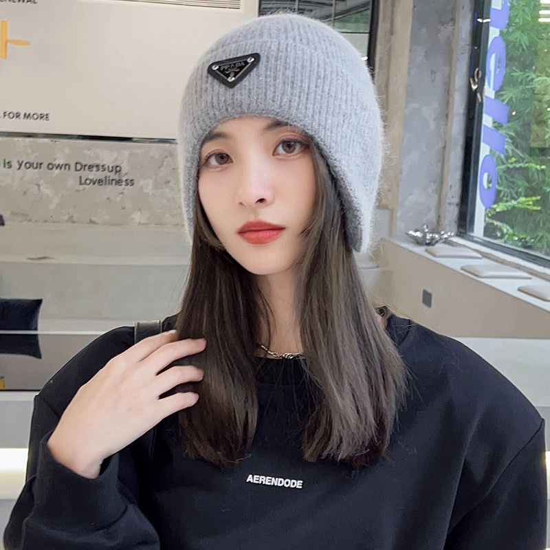 Mũ bảo vệ tai ấm áp của phụ nữ nam giới yêu thích nhãn tam giác mùa thu và mùa đông gió và bảo vệ lạnh áo pull dệt kim đi xe đạp ngoài trời boutique mũ len lông thỏ