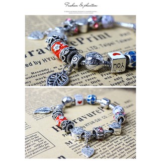 Vòng tay charm đồng hồ và chiếc lá