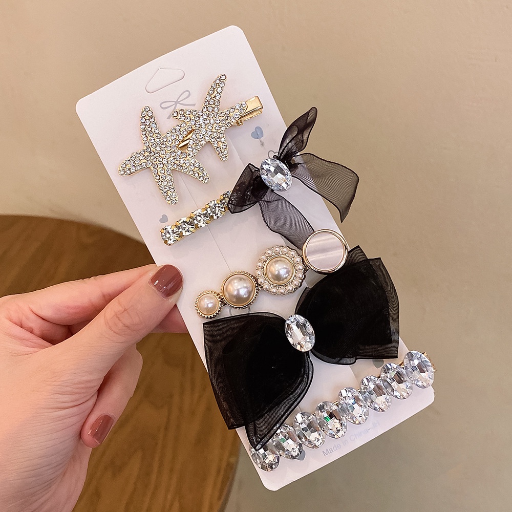 Kẹp Tóc Hình Sao Biển Đính Nơ Xinh Xắn Cho Nữ