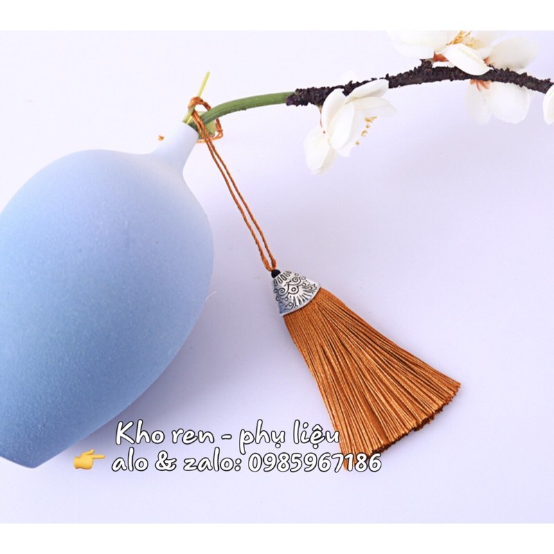 Tua rua trang trí áo dài