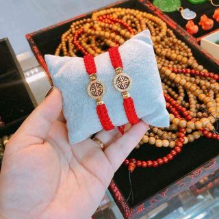 Vòng tết bánh xe pháp luân bạc mạ vàng