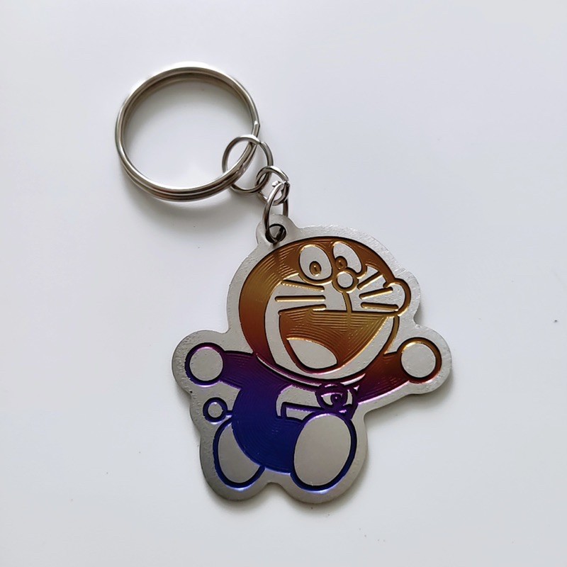 Tổng hợp mẫu móc khoá Titan, logo Titan King Drag Doraemon Michelin Mèo thần tài Pikachu Durex. Móc có sẵn khoen