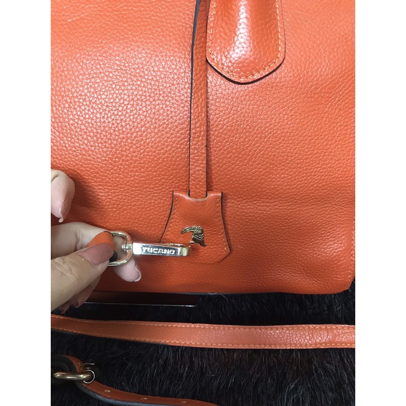 👜  Túi cầm tay, đeo chéo da thật màu cam hiệu Tucano