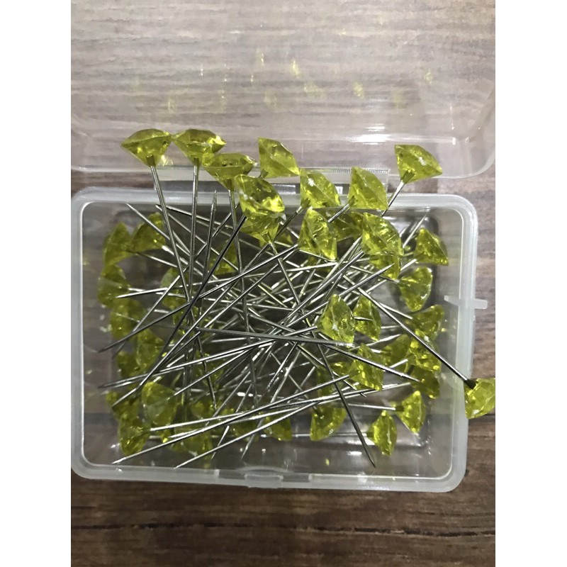 Ghim định vị đan móc áo