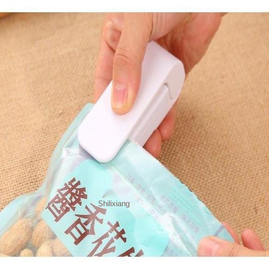 máy hàn miệng túi ni lông dán viền thực phẩm điện phong cách Nhật Bản đóng gói hút chân không mini giấy ly nhà