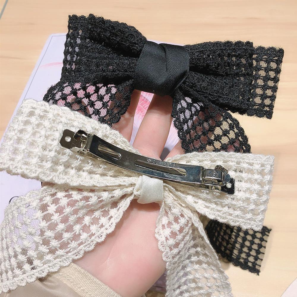 MAG Kẹp Tóc Đuôi Ngựa Màu Trắng Đen Thanh Lịch