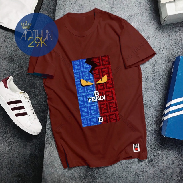 ALBUM 134 - ÁO THUN UNISEX ĐỎ ĐÔ HOẠ TIẾT RẰN RI MẮT VÀNG CÁ TÍNH | BigBuy360 - bigbuy360.vn