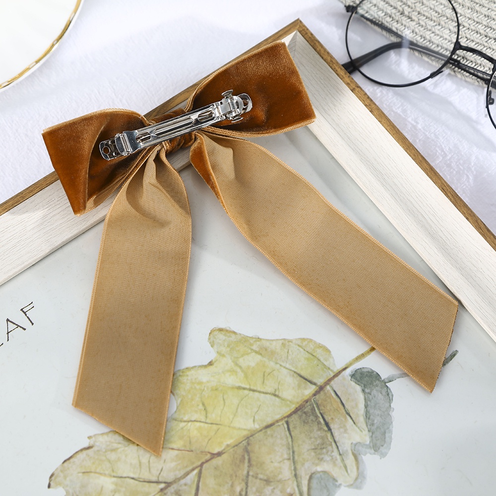 Kẹp tóc Haimeikang gắn nơ đính ngọc trai bằng