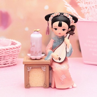 Tượng thiếu nữ cổ trang đánh đàn bên đèn