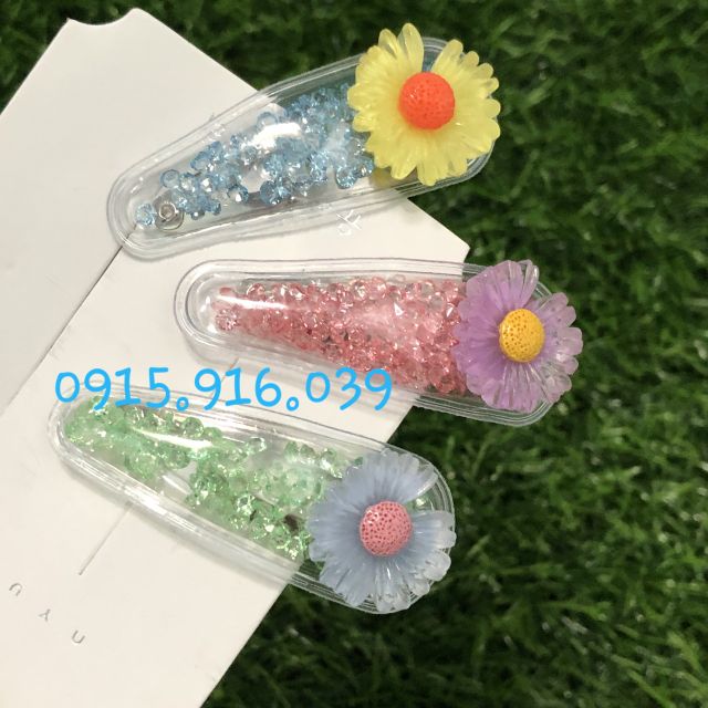 Kẹp tóc trong suốt đính bông cúc