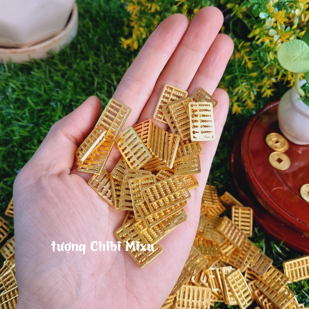 01 bàn tính Thần Tài kim loại size 20x13x1,1mm / 41x23x1.5mm