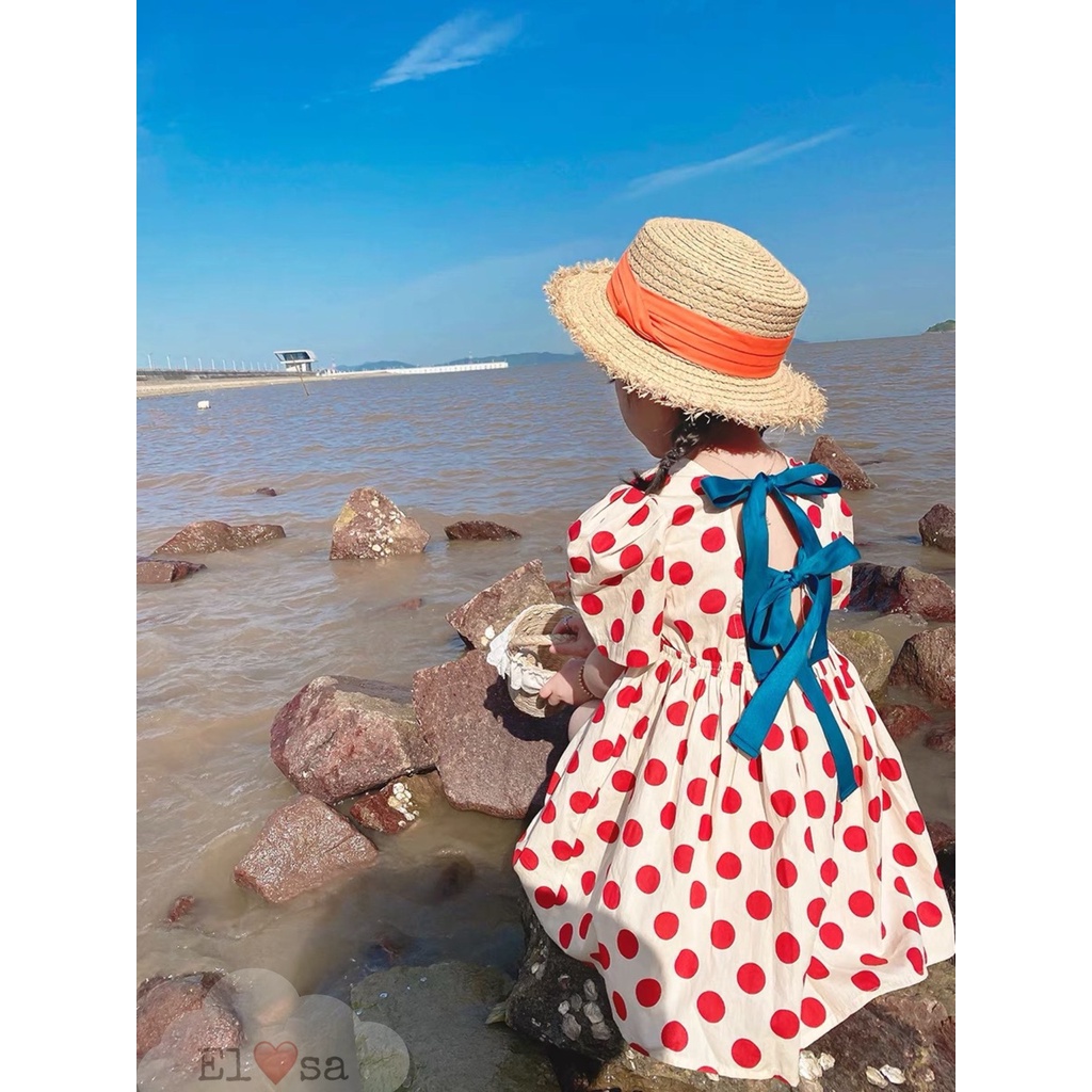 Váy bé gái babydoll tay phồng phối 2 nơ xanh phía sau họa tiết chấm bi xinh xắn, dáng xòe cho bé gái từ 9 đến 19 kg