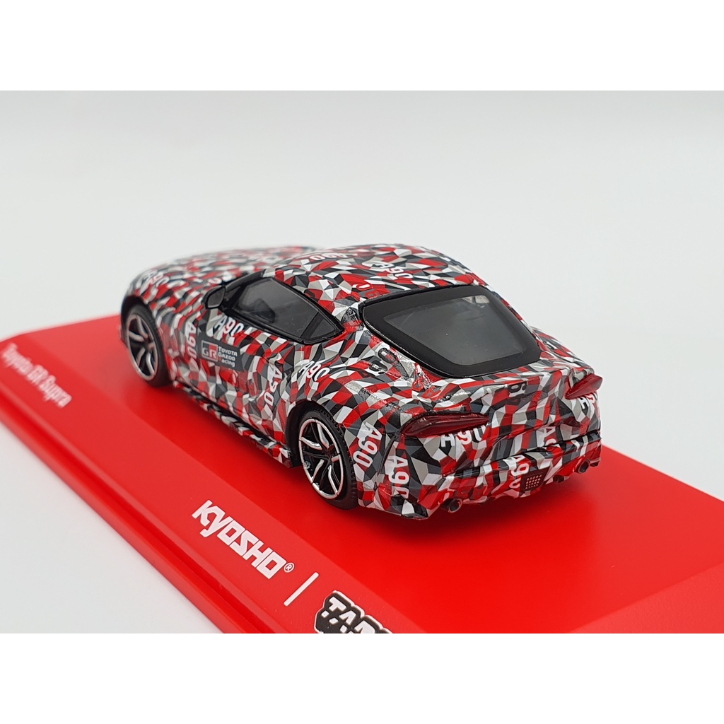 Xe Mô Hình Toyota GR Supra TEST CAR 1:64 Tarmac Works/Kyosho(CARO ĐỎ XÁM)