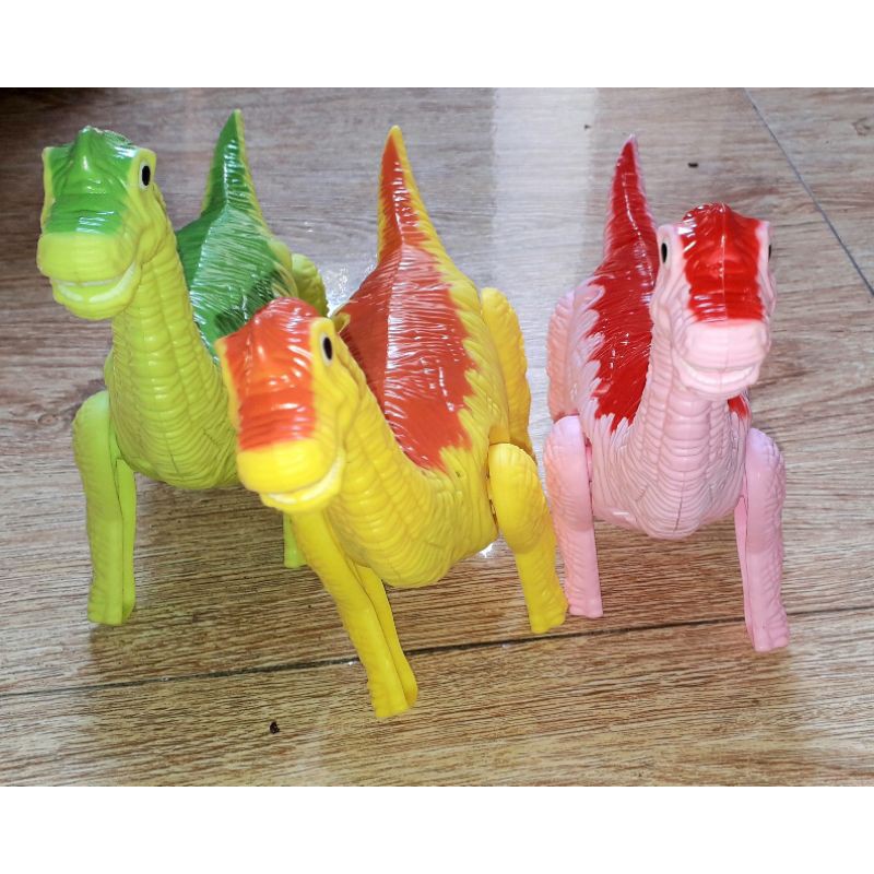 Một Khủng Long mô hình bằng nhựa kích thước 24x16x8 cm chạy pin có nhạc và đèn Led rất đep_tặng kèm pin