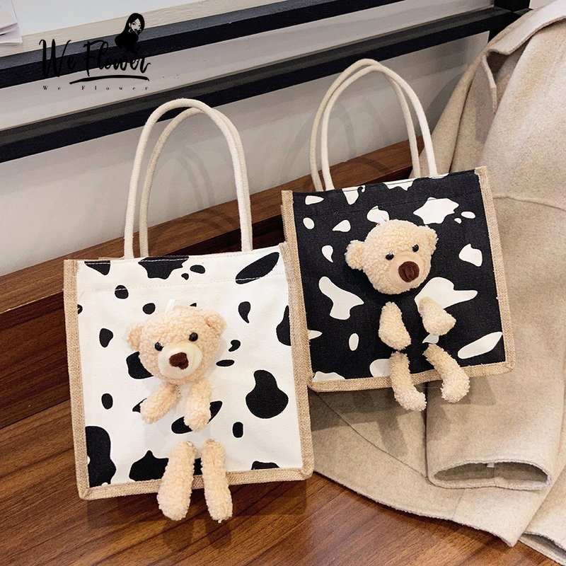 Túi xách tote WE FLOWER đựng mỹ phẩm vải canvas có khóa kéo trang trí nhân vật hoạt hình dễ thương