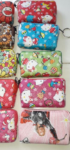 Một cái ví_bóp da Pu mini đa năng có dây kéo kích thước 10x6x3 cm rất đẹp