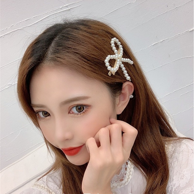 Kẹp Tóc Hình Nơ Đính Hoa Trà Và Ngọc Trai Dễ Thương Cho Nữ